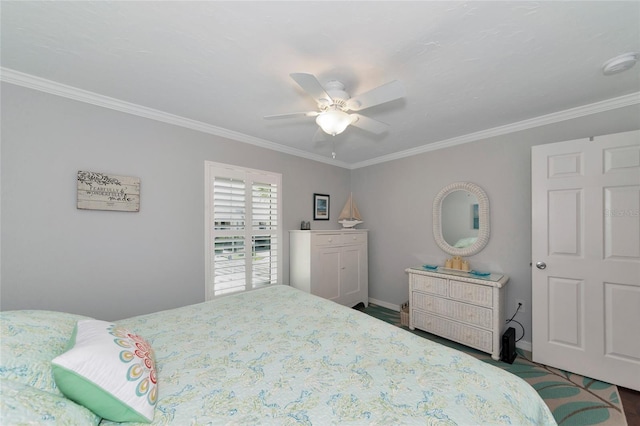 bedroom with ornamental molding and ceiling fan