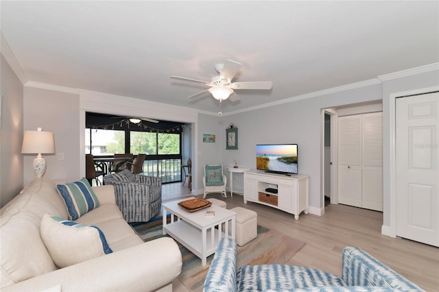 living room with ornamental molding, ceiling fan, and light hardwood / wood-style flooring