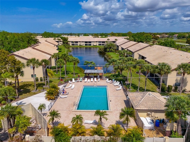 view of pool with a water view and a patio area