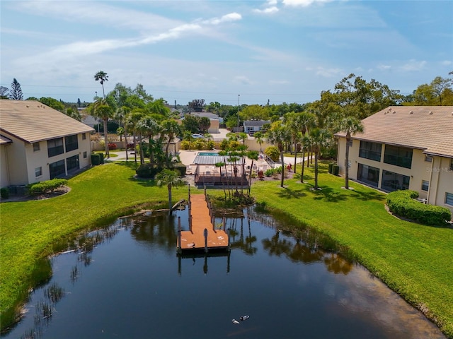 birds eye view of property with a water view