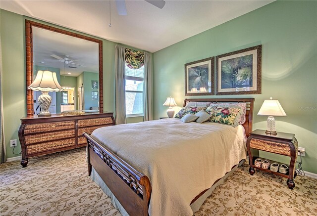 bedroom featuring ceiling fan and carpet floors