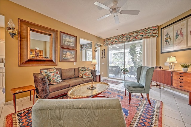 tiled living room featuring ceiling fan and a textured ceiling