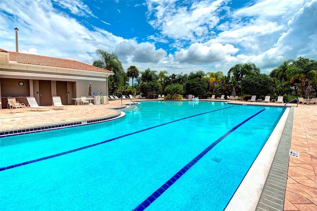 view of swimming pool with a patio area