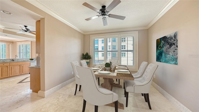 401 N Point Rd Unit 301, Osprey, FL 34229 - dining area with ceiling fan, sink, light tile floors, a textured ceiling, and crown molding