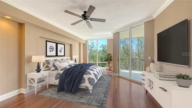 401 N Point Rd Unit 301, Osprey, FL 34229 - bedroom with dark wood-type flooring, a textured ceiling, ceiling fan, and access to outside