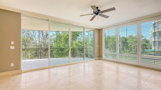 401 N Point Rd Unit 301, Osprey, FL 34229 - tiled spare room with plenty of natural light, a textured ceiling, and ceiling fan