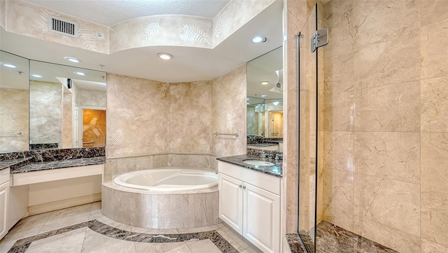 401 N Point Rd Unit 301, Osprey, FL 34229 - bathroom with vanity, a textured ceiling, tile floors, and shower with separate bathtub