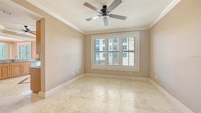 401 N Point Rd Unit 301, Osprey, FL 34229 - tiled spare room featuring ornamental molding, ceiling fan, a textured ceiling, and sink