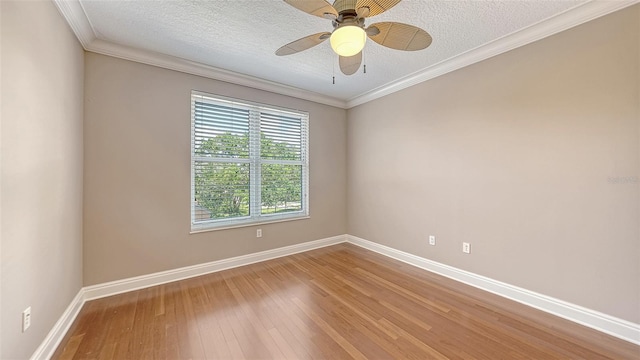 401 N Point Rd Unit 301, Osprey, FL 34229 - spare room with a textured ceiling, ornamental molding, ceiling fan, and light wood-type flooring