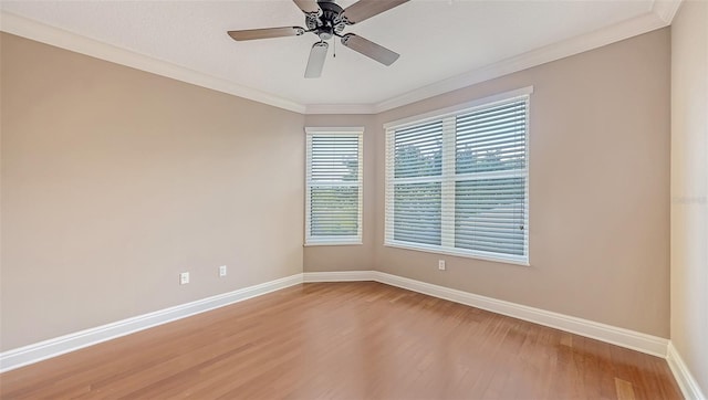 401 N Point Rd Unit 301, Osprey, FL 34229 - empty room featuring ceiling fan, a wealth of natural light, and light wood-type flooring