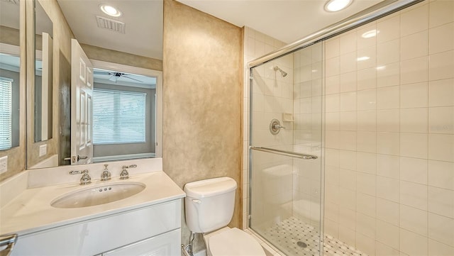 401 N Point Rd Unit 301, Osprey, FL 34229 - bathroom featuring toilet, a shower with door, large vanity, and a wealth of natural light