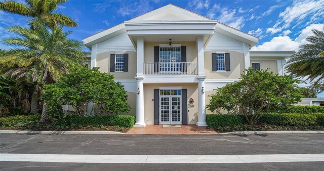401 N Point Rd Unit 301, Osprey, FL 34229 - greek revival inspired property with a balcony and french doors