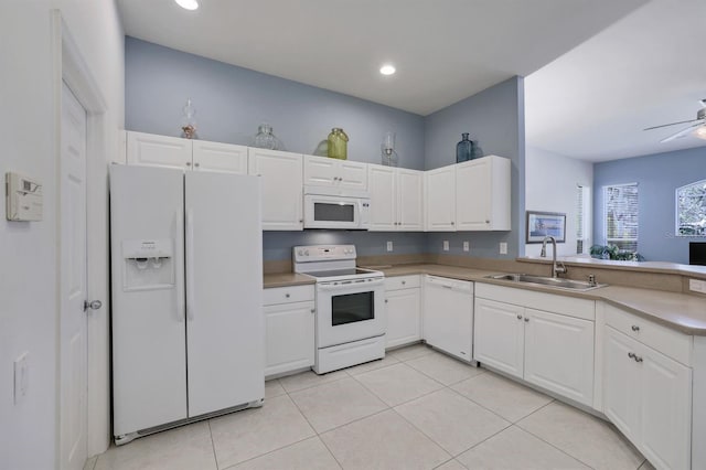 kitchen with white appliances, ceiling fan, light tile floors, sink, and white cabinets