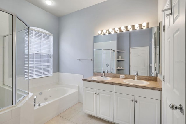 bathroom with dual bowl vanity, separate shower and tub, and tile floors