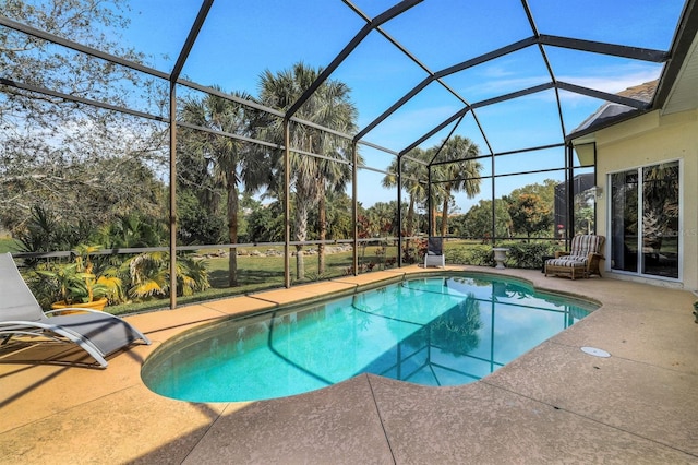 view of pool with a patio and a lanai