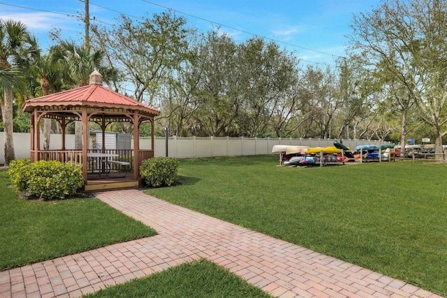 view of yard featuring fence and a gazebo