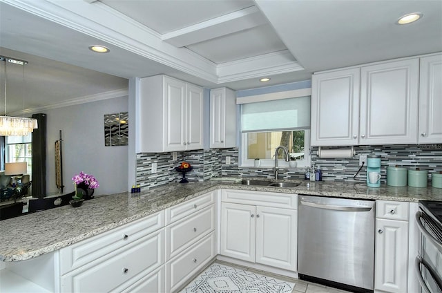 kitchen featuring backsplash, light stone counters, sink, and stainless steel dishwasher