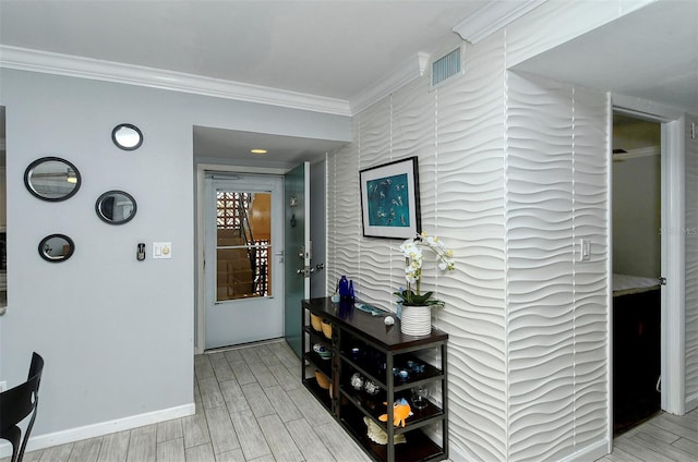 hallway with light hardwood / wood-style floors and ornamental molding