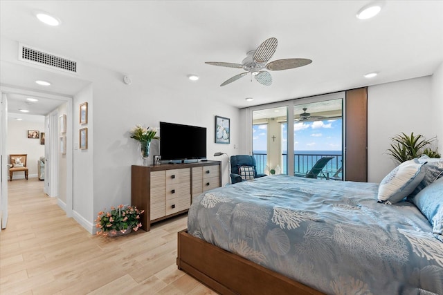 bedroom featuring light hardwood / wood-style flooring, access to outside, and ceiling fan