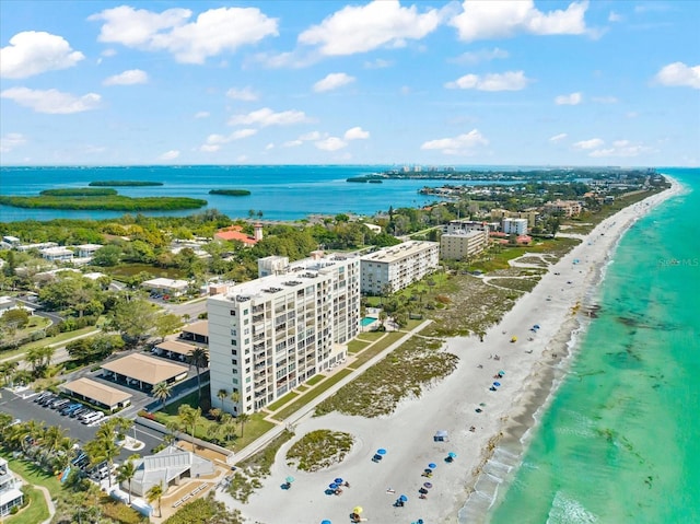 drone / aerial view with a beach view and a water view