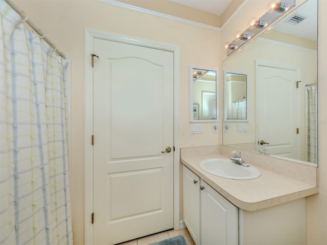 bathroom featuring tile patterned floors, vanity, and a shower with shower curtain