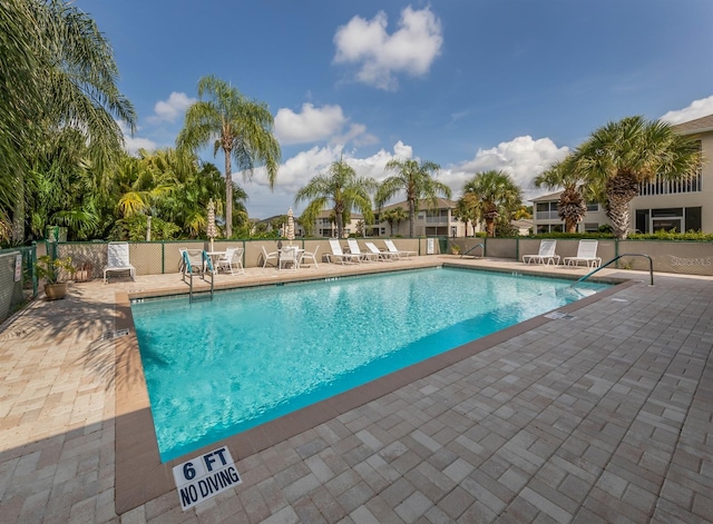 view of pool featuring a patio