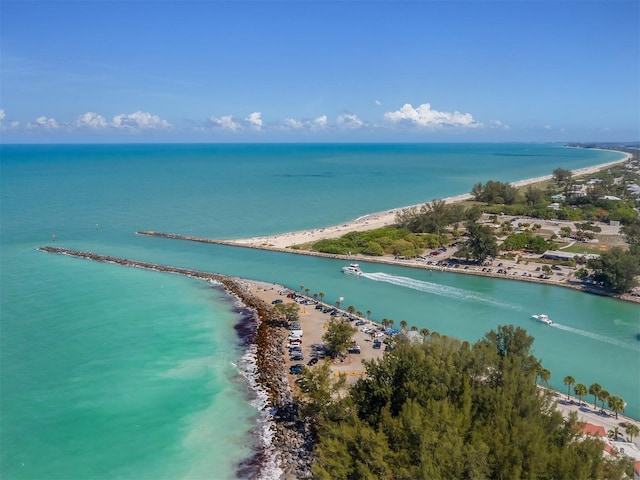 drone / aerial view featuring a water view and a beach view