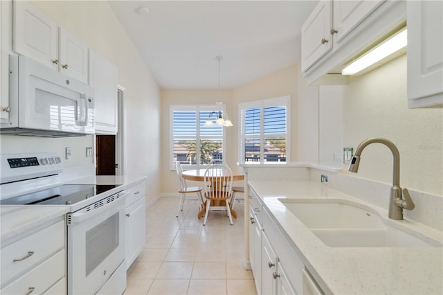 kitchen featuring white appliances, sink, decorative light fixtures, light stone counters, and white cabinetry