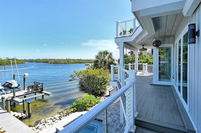 exterior space featuring a water view and a boat dock