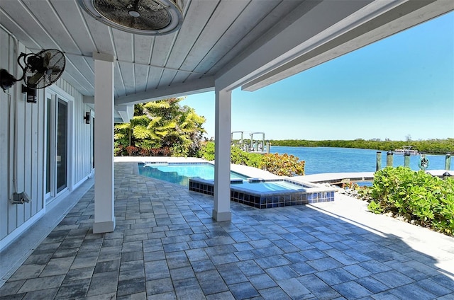 view of terrace with a pool with hot tub and a water view