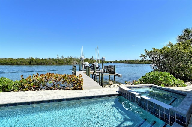 view of pool with an in ground hot tub, a boat dock, and a water view