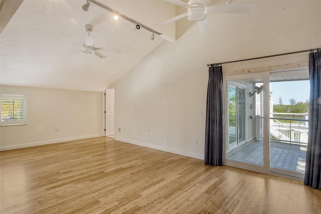 interior space with vaulted ceiling, ceiling fan, and light wood-type flooring