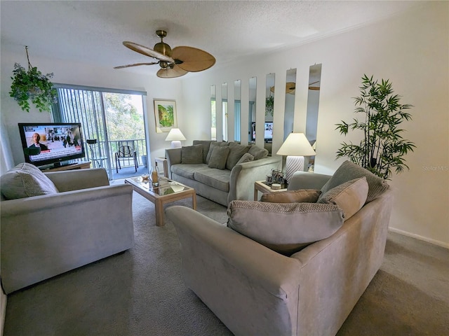 living room featuring dark colored carpet, ceiling fan, and a textured ceiling