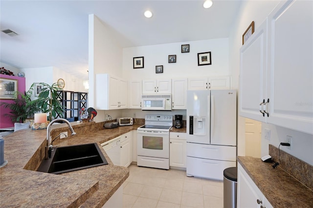 kitchen featuring white appliances, white cabinets, sink, and light tile floors