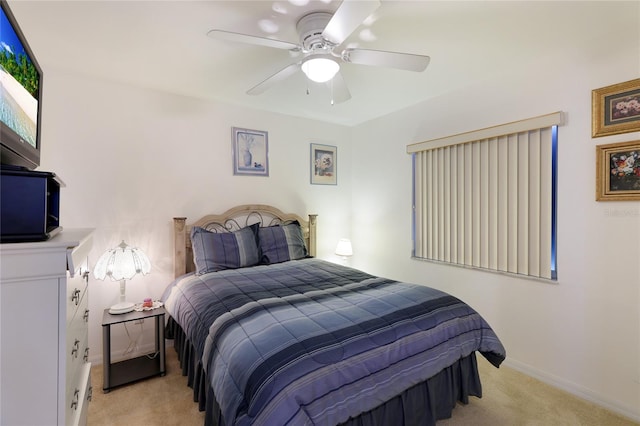 bedroom with light colored carpet and ceiling fan