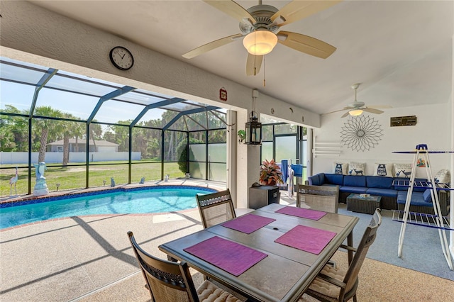 view of pool featuring a lanai, a patio area, an outdoor living space, and ceiling fan