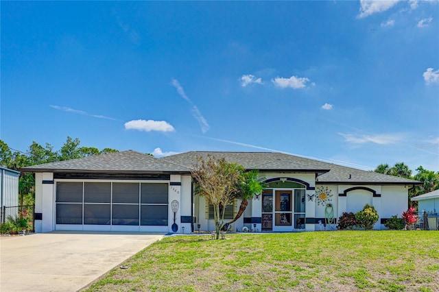 ranch-style home featuring a front yard and a garage