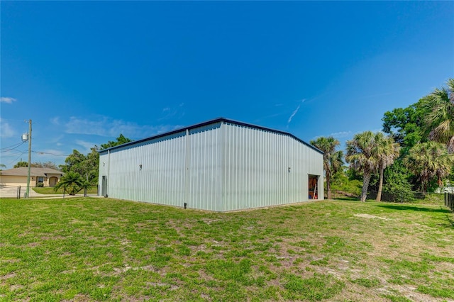 view of shed / structure featuring a lawn