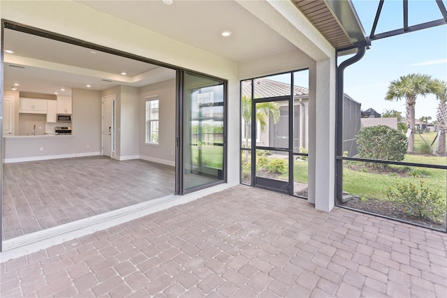 unfurnished sunroom featuring sink