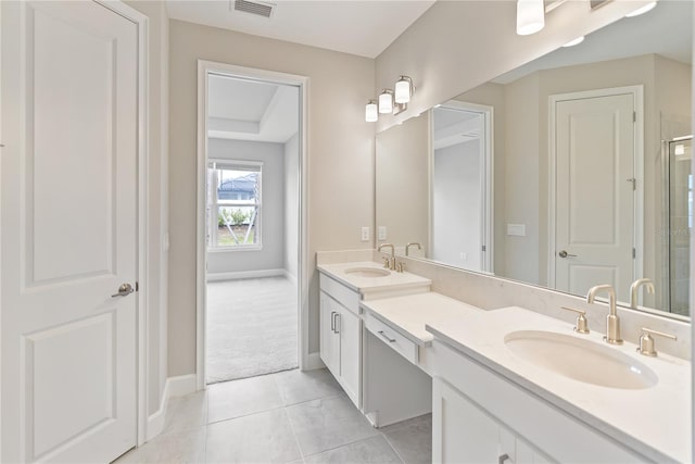 bathroom with tile flooring and dual bowl vanity