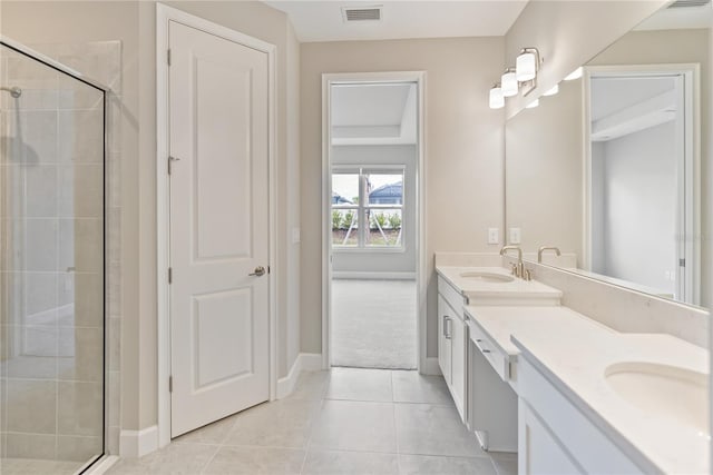 bathroom with an enclosed shower, dual vanity, and tile flooring