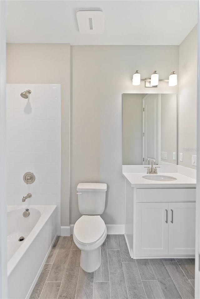 full bathroom featuring vanity, shower / bathtub combination, and toilet