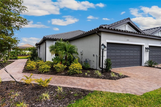 view of side of home featuring a garage