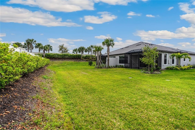 view of yard with a lanai