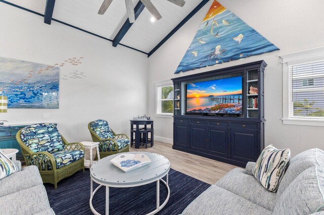 living room with high vaulted ceiling, ceiling fan, plenty of natural light, and hardwood / wood-style floors