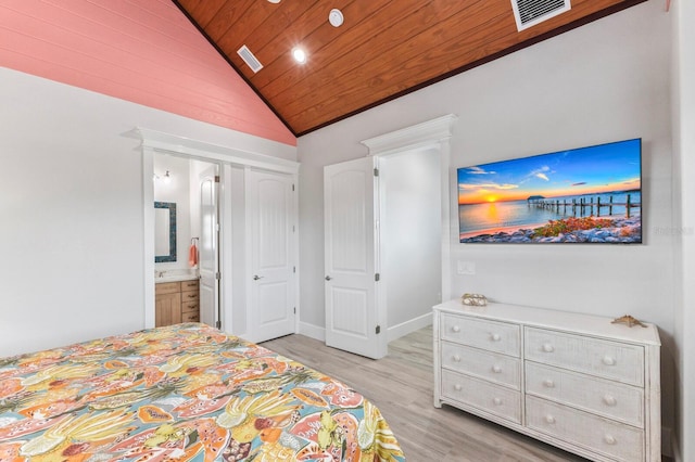 bedroom featuring light hardwood / wood-style flooring, ensuite bathroom, high vaulted ceiling, and wooden ceiling