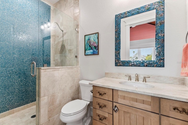 bathroom featuring walk in shower, vanity, and toilet