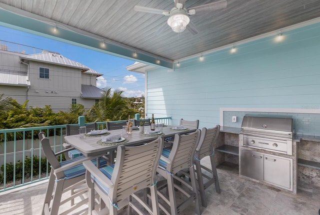 view of patio / terrace featuring a grill, ceiling fan, and an outdoor kitchen