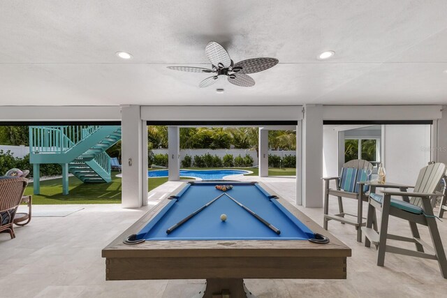 game room featuring ceiling fan, a textured ceiling, and billiards