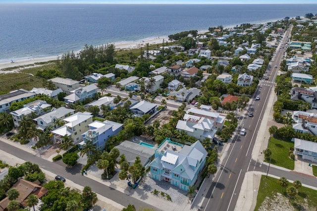 bird's eye view featuring a water view and a view of the beach